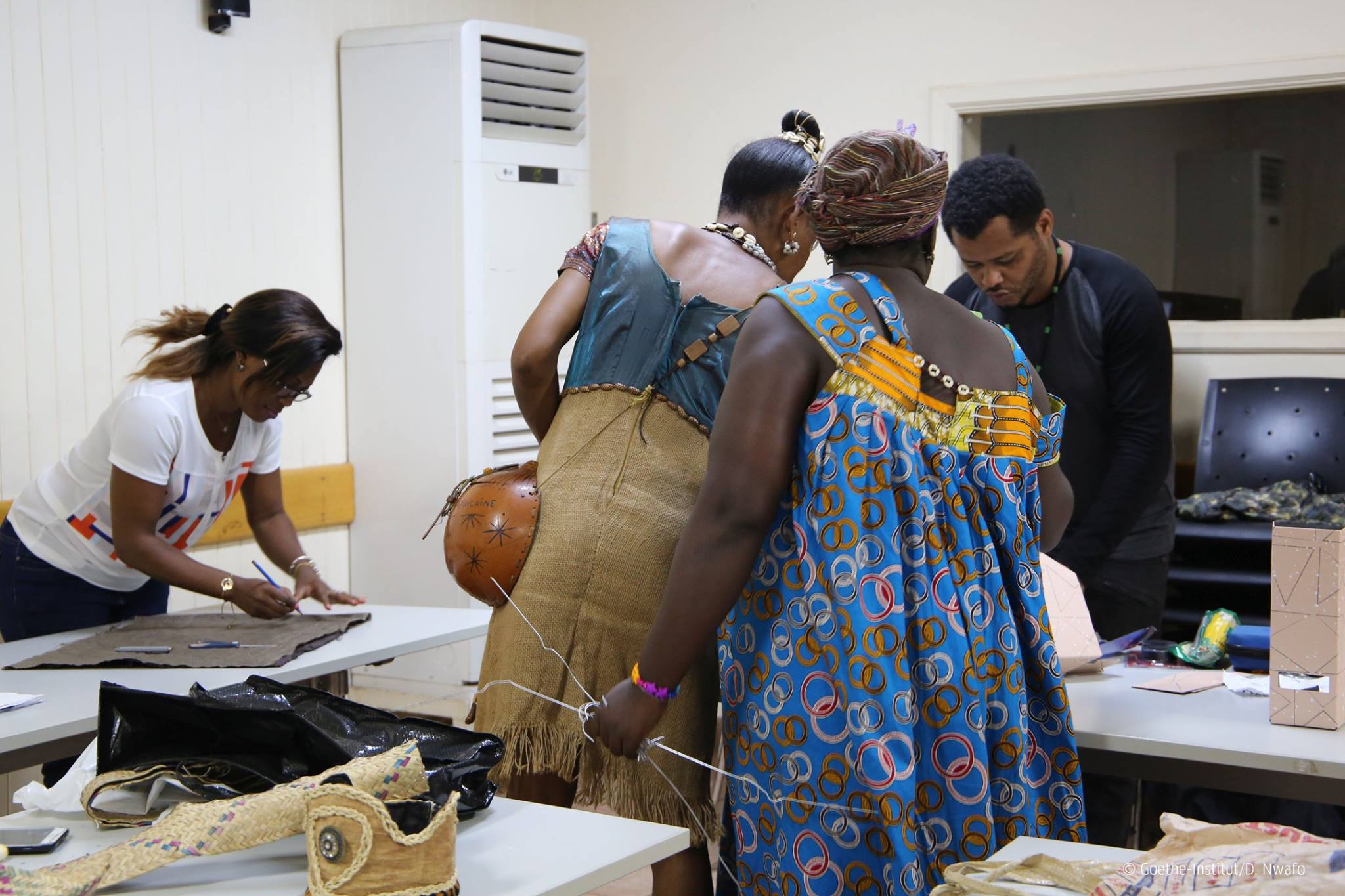 Workshop participants make their costumes using recycled materials.