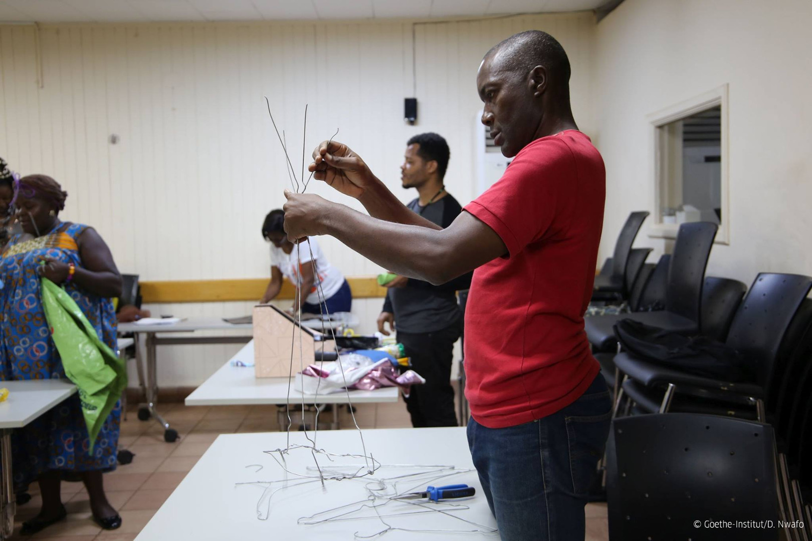 Workshop participants are making their costumes with recycled materials.