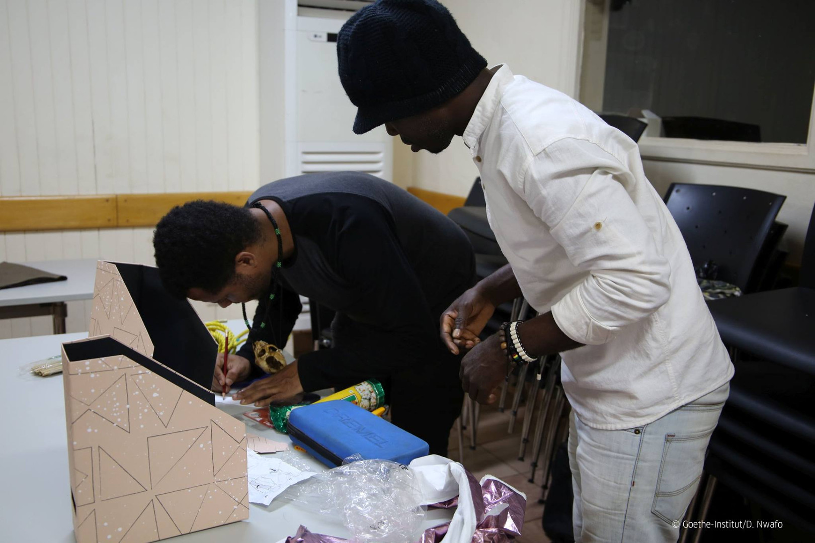 Workshop participants are making their costumes with recycled materials.