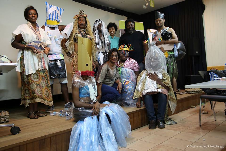 Workshop participants pose for a photo showing their creations.